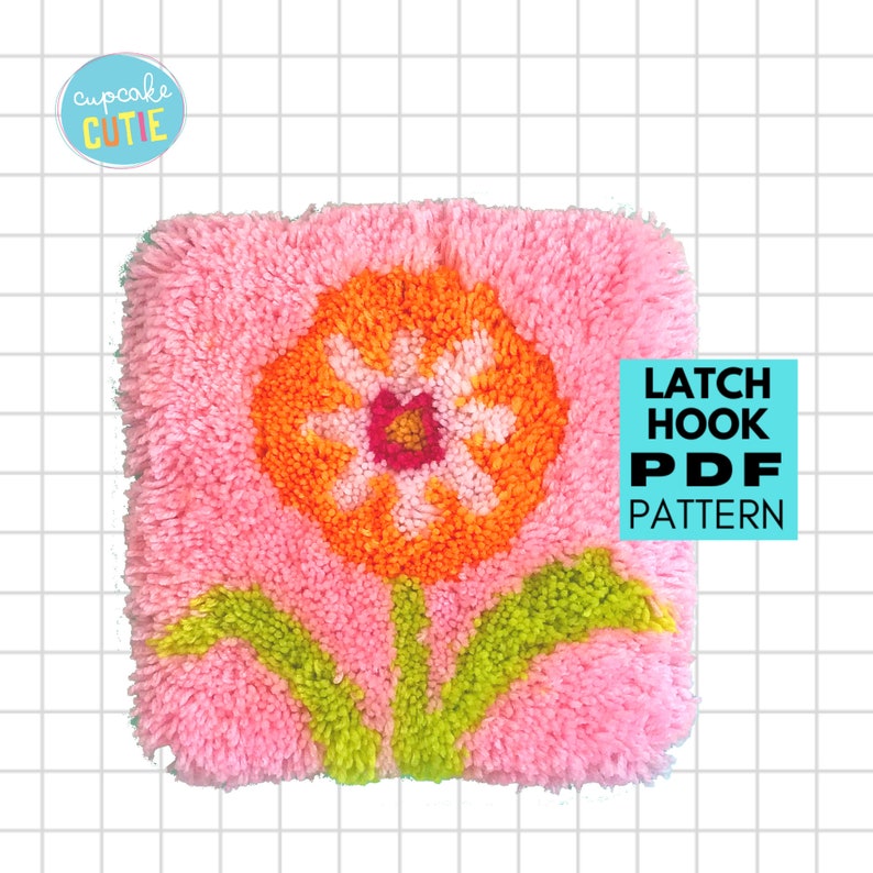 May include: A latch hook PDF pattern for a pink and orange flower with green leaves. The pattern is titled "Latch Hook PDF Pattern".