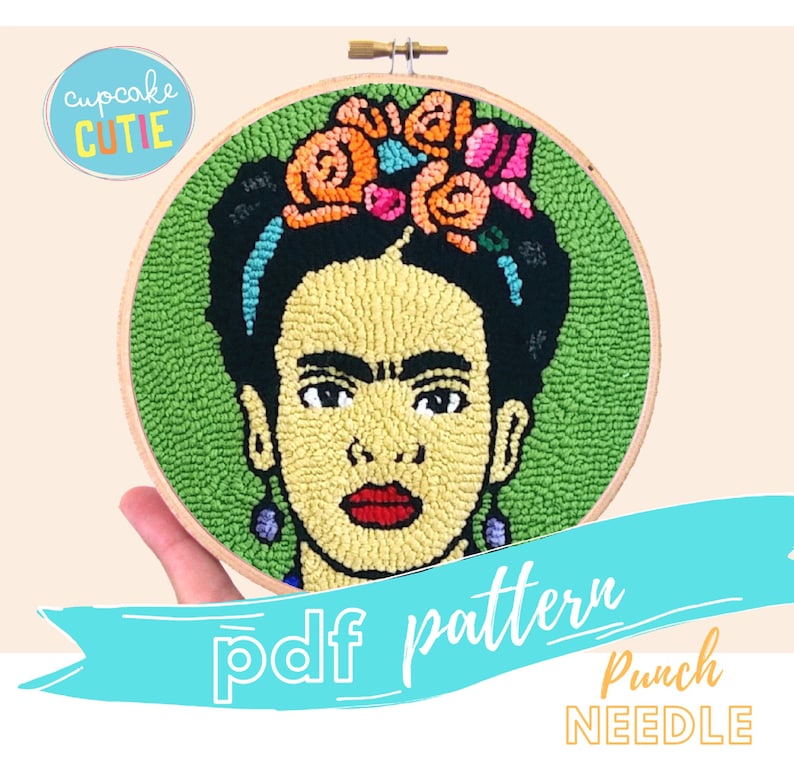 May include: A PDF pattern for a punch needle embroidery project featuring a portrait of Frida Kahlo with a flower crown. The pattern is for a round hoop and includes the text "pdf pattern" and "Punch Needle".