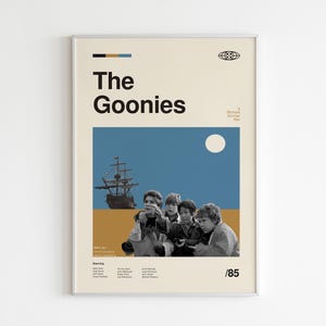 May include: A vintage-style poster for the film "The Goonies", featuring a group of children looking out at a ship sailing on a blue sea with a yellow beach in the foreground. The poster has a white background with a black title and a yellow and blue colour scheme.