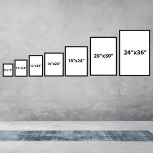 May include: A wall with a variety of black picture frames, each with a different size and measurement printed in white. The measurements are 9"x11", 11"x14", 12"x18", 16"x20", 18"x24", 20"x30", and 24"x36".