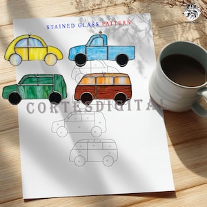 May include: A sheet with a "STAINED GLASS PATTERN" title and car designs. Four stained glass car ornaments in yellow, blue, green, and orange are displayed. A mug of coffee sits to the right. The text "CORTES DIGITAL" is printed on the sheet.