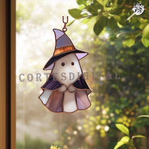 May include: A stained glass Halloween decoration in the shape of a ghost wearing a witch hat. The ghost is white with a purple cape and a hat with black, orange, and gray accents. The text "CORTES DIGITAL" is visible.