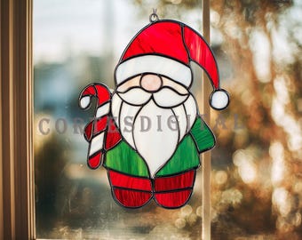 May include: Stained glass Christmas decoration in the shape of Santa Claus, with a red hat and suit, white beard, and green accents. A candy cane is held in one hand. The text "CORES DIGITAL" is visible.