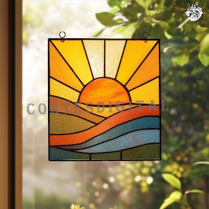 May include: Square stained glass panel featuring a sunset scene. The sun is a bright orange orb with yellow rays. Below, rolling hills are rendered in green, orange, and blue. The panel has a black border and is designed to hang.