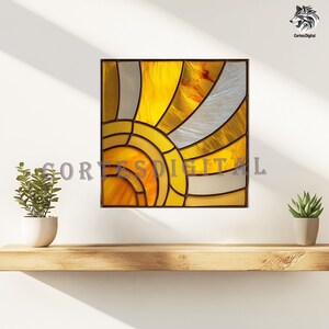 May include: A square stained glass artwork featuring a sun design in shades of yellow, orange, and silver, set within a dark brown frame. The piece is mounted on a white wall. The text "Cortes Digital" is partially visible.