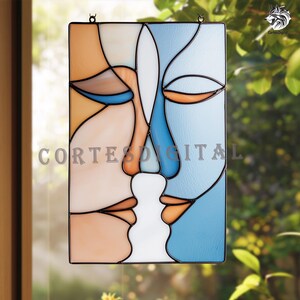 May include: Stained glass panel with an abstract design of two faces in profile, using orange, blue, and white sections. The artwork is framed in black and includes the text "CORTES DIGITAL".