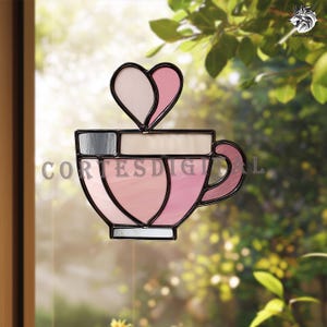 May include: A stained glass window panel depicting a coffee cup with a heart-shaped steam. The cup is in shades of pink and white, with a black outline. The text "CORTES DIGITAL" is visible.