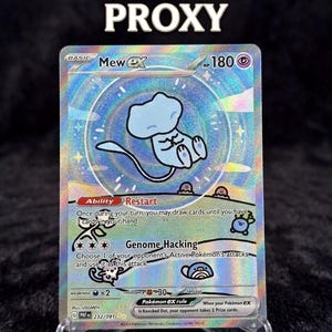 May include: A holographic Mew ex Pokémon trading card. The card features a light blue Mew character with the text "BUBBLE MEW PROXY" at the top. The card is displayed in a clear plastic holder.
