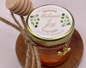 Honey - Wedding Favors. Small personalized jars of honey accompanied by a honey dipper and a golden bee pendant.