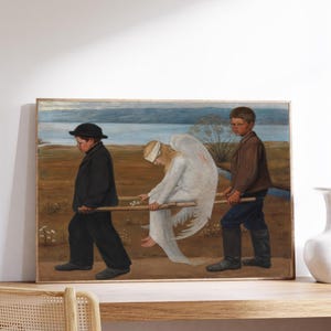 May include: A framed painting shows two boys bearing a blindfolded angel on a stretcher. The angel is in a white gown with large white wings. The boys are in dark clothes, walking on a brown field with a body of water in the background.