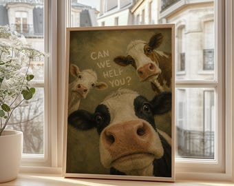 May include: A rectangular wall art print featuring three cows against a muted olive green background. The text CAN WE HELP YOU? is printed in white. One cow is black and white, one is brown and white, and one is white with dark eyes.