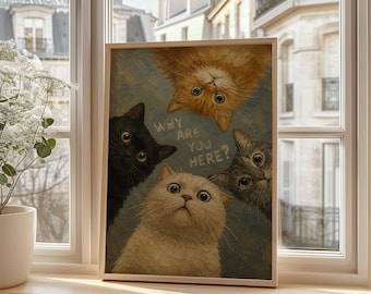 May include: A rectangular framed print featuring an oil painting of four cats: one orange, one black, one white, and one grey tabby, all looking upward with wide eyes. The text "WHY ARE YOU HERE?" is printed in the center against a blue background.