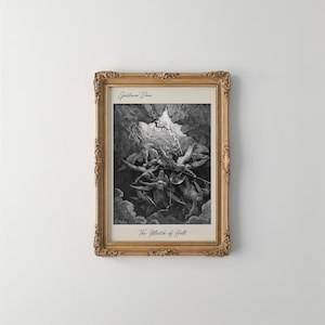 May include: A framed black and white art print titled The Mouth of Hell by Gustave Dore. The image depicts a chaotic scene of figures in a dark, cavernous space with a bright light source above. The frame is ornate, metallic gold, and rectangular.