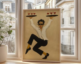 May include: A framed artwork depicts a waiter in a white shirt, black pants, and yellow polka-dot socks, balancing trays of wine glasses. The artwork has a light brown background and is set in a wooden frame. The waiter is wearing sunglasses.