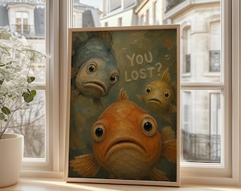 May include: A rectangular framed wall art print featuring three fish with wide eyes and downturned mouths against a textured blue-green background. The text "YOU LOST?" is printed in a light, raised-style font above the central orange fish.