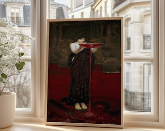 May include: A framed print of a painting depicting a woman in a dark dress holding a red bowl, with red liquid flowing down. The artwork has a dark, moody aesthetic, with a red and brown color palette. The frame is a light wood color.