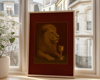May include: A framed artwork featuring a regal lion with a golden chalice. The lion, rendered in warm tones, is set against a dark background within a red frame. The artwork is displayed on a wooden windowsill, with a view of a city.