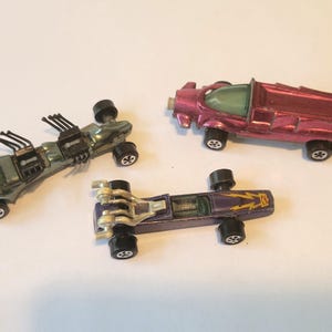 Lot of vintage Johnny Lightning triple threat Al Unser monster toy cars by Topper