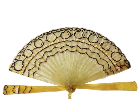 Antique yellow celluloid folding fan