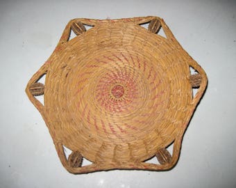 Antique straw basket with nuts woven in