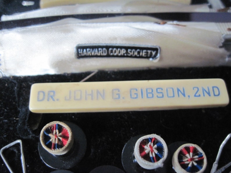 Vintage mens button cufflinks and badge in snakeskin hard case with mirror from Harvard Coop Society