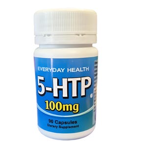 May include: A white plastic bottle with a white cap, labelled "EVERYDAY HEALTH 5-HTP 100mg." The label is blue and white, with the text "90 Capsules Dietary Supplement." The bottle contains capsules.
