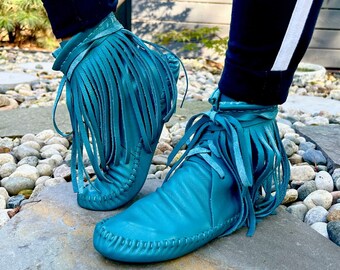 handmade moccasins | indigenous maker | fringe moccasin boots | moccasin boots | peacock | barefoot shoes | bridal shoes