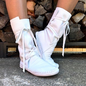 handmade moccasins | indigenous maker | moccasins | hi-top moccasins | moccasin boots | wrap boot moccasins | white leather | barefoot shoes