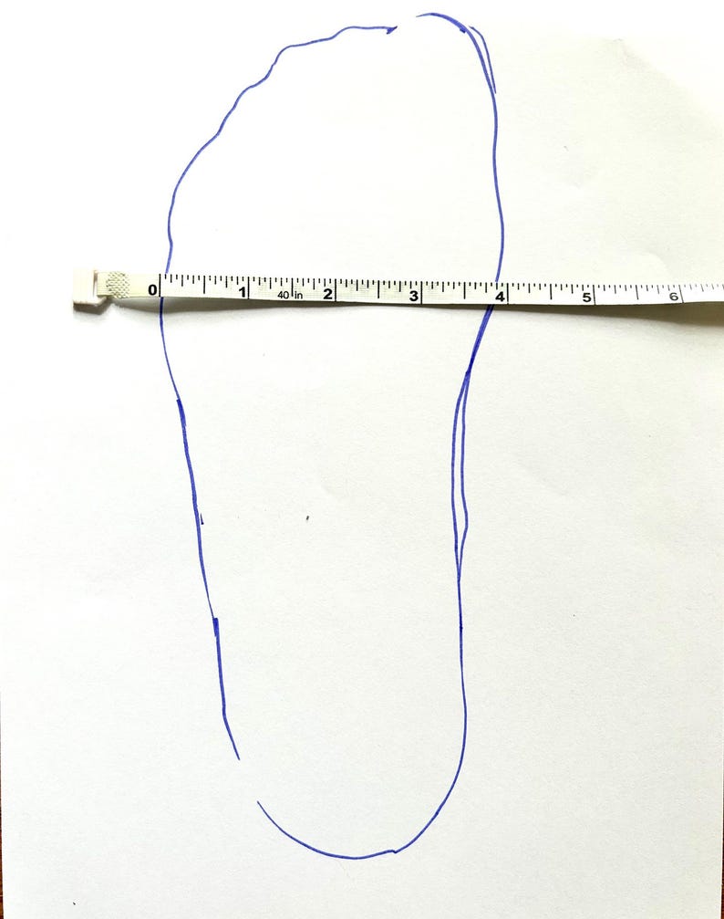 May include: A blue outline of a foot drawn on white paper with a measuring tape placed across the foot. The foot measures approximately 4 inches in length.