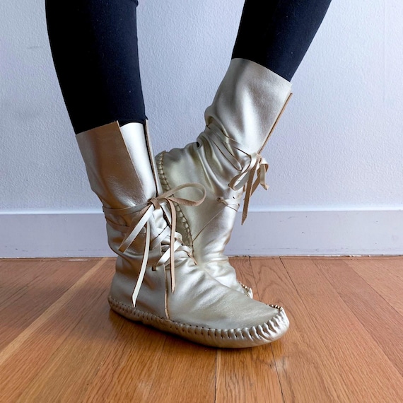 handmade moccasins | indigenous maker | tall boots | moccasin boots | wrap up laces | metallic gold dust | barefoot shoes | bridal shoes