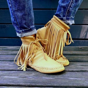 handmade moccasins | indigenous maker | fringe moccassins | fringe boot | hi-top moccasins | moccasin boots | butterscotch | barefoot shoes