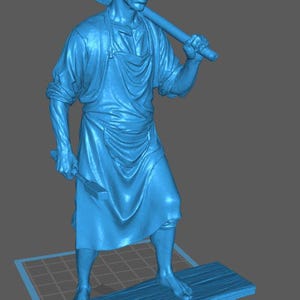 May include: A blue sculpture of a man in a work apron, holding a hammer and a mallet. The figure stands barefoot on a wooden platform. The man has short hair and a serious expression. The sculpture is set against a gray background.