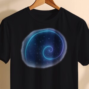 May include: Black t-shirt featuring a spiral galaxy design. The graphic has a blue and purple neon outline with a starry background. The shirt is hanging on a wooden hanger against a neutral background.
