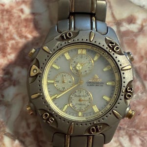 Citizen Solar Tech Titanium Chronograph Alarm Rotating Bezel WR 200 Watch Luminous Date Japan