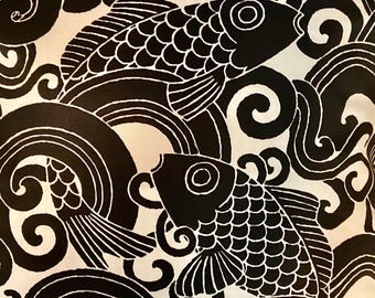 Fabric by the yar bold graphic “Waveform” in color onyx. Asian inspired Fish in the waves print great for living room, porch, sunroom. Black