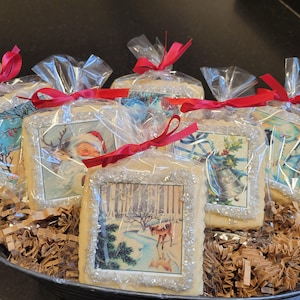 May include: A basket filled with six individually wrapped Christmas cookies. Each cookie is decorated with a vintage Christmas image and topped with sparkling sugar.