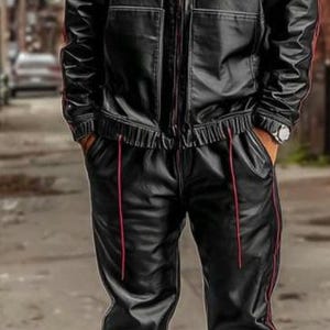 May include: Black leather tracksuit with red trim. The jacket has a hood and a zip closure. The pants have a drawstring waist. The outfit is paired with black and white sneakers.