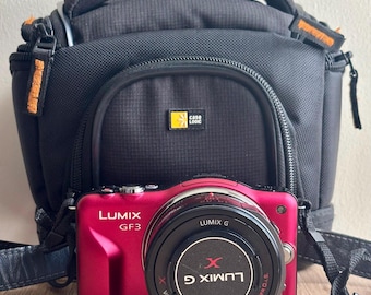 Panasonic Lumix DMC-GF3 red mirrorless camera with 14-42mm lens