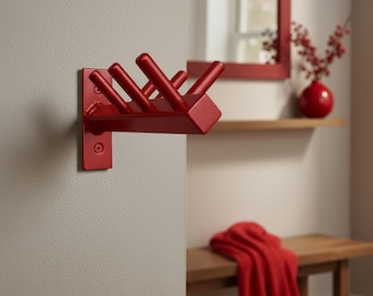 Perchero de pared rojo, ganchos de pared de colores llamativos, organizador moderno para la entrada.