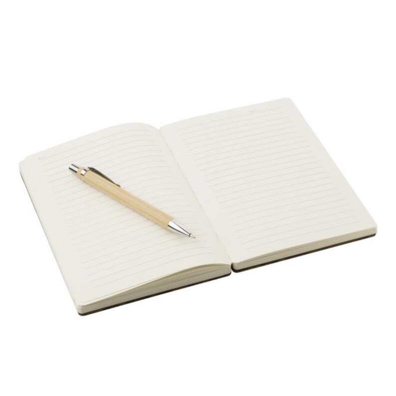 May include: An open notebook with lined pages and a light brown pen. The pen is resting on the left page of the notebook. The notebook has a black cover and the pages are off-white.