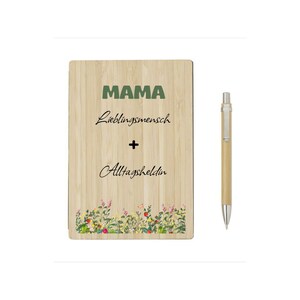 May include: A wooden plaque with the word "MAMA" in green, followed by text in cursive. The plaque has a floral border at the bottom. A pen with a silver tip and a light brown barrel is to the right.