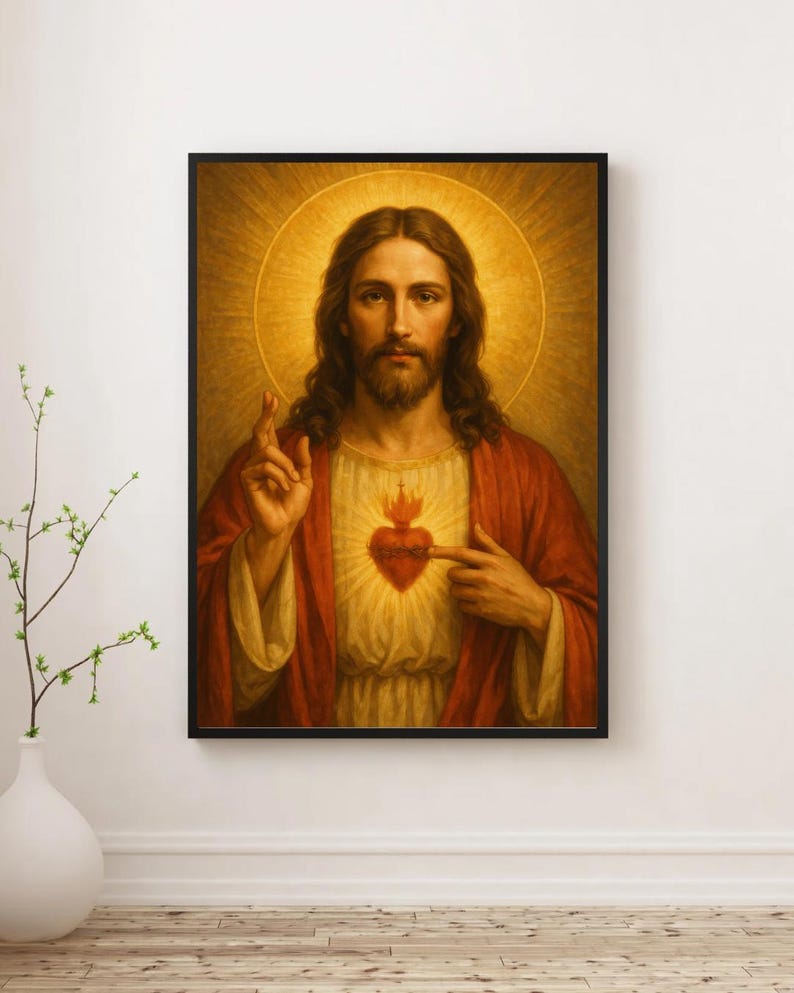 May include: A framed religious portrait depicts a figure with long brown hair and a beard, wearing a red robe and a white tunic. A golden halo surrounds the figure's head. The figure points to a flaming heart on their chest.