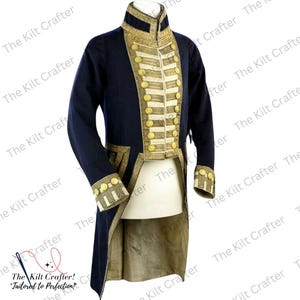 May include: A navy blue tailcoat with gold and white trim. The coat has a high collar and a long, flowing tail. The coat is decorated with gold buttons and a gold braid.