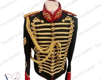 May include: Black military-style jacket with gold and red accents. The jacket features gold braid, buttons, and epaulets. The collar and cuffs are red with gold embroidery. The Kilt Crafter logo is visible.
