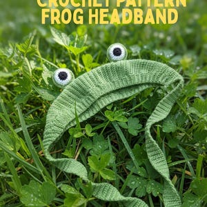 May include: A green crochet frog headband with large, round eyes and long, trailing ties, resting in a bed of green grass and clover. The text "CROCHET PATTERN FROG HEADBAND" is displayed in yellow above the headband.