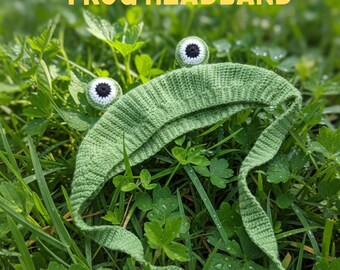 May include: A green crochet frog headband with large, round eyes and long, trailing ties, resting in a bed of green grass and clover. The text "CROCHET PATTERN FROG HEADBAND" is displayed in yellow above the headband.