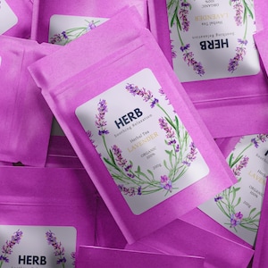 May include: Close-up of several pink pouches of lavender herbal tea. Each pouch has a white label with the word "HERB" and "LAVENDER" with a lavender sprig design. The text "Soothing Relaxation" is also visible.