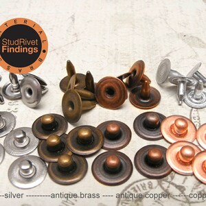 May include: Assortment of metal rivets in silver, antique brass, antique copper, and copper finishes. The rivets are in various sizes and shapes, including round, square, and oval.