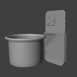May include: A gray phone holder with a cup holder attached. The phone holder has a textured surface and the cup holder is cylindrical.