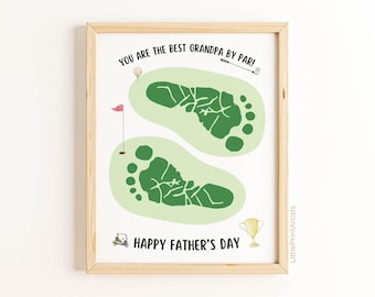 May include: A framed print with a light wood frame. The artwork features two green footprints on a light green golf course design. Text reads "YOU ARE THE BEST GRANDPA BY PAR!" and "HAPPY FATHER'S DAY". Includes golf-themed illustrations.